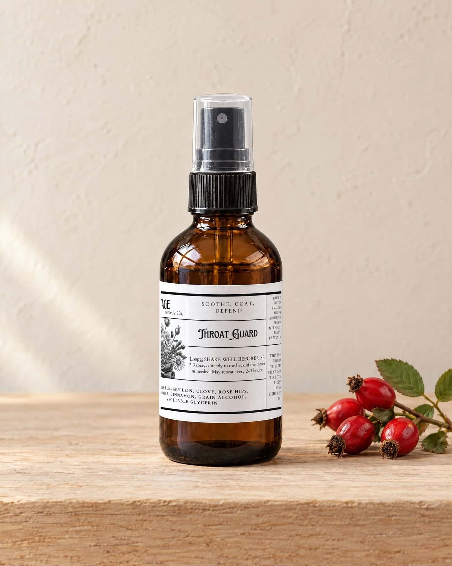A spray bottle of Throat Guard Spray on a pale oak shelf, a small cluster of red rose hips beside it